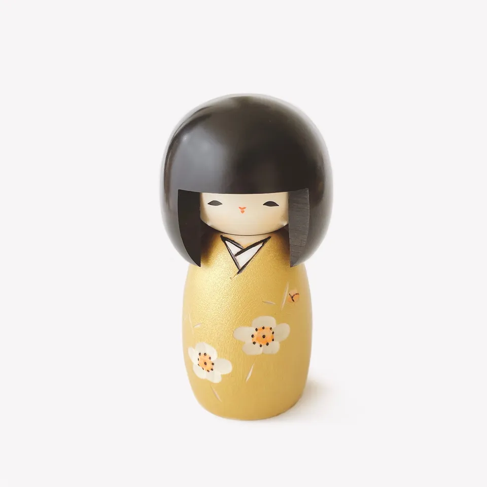 usaburo-kokeshi-kaika-gold-poup-e-kokeshi-artisanale-13-cm-prune-dor-e image 1