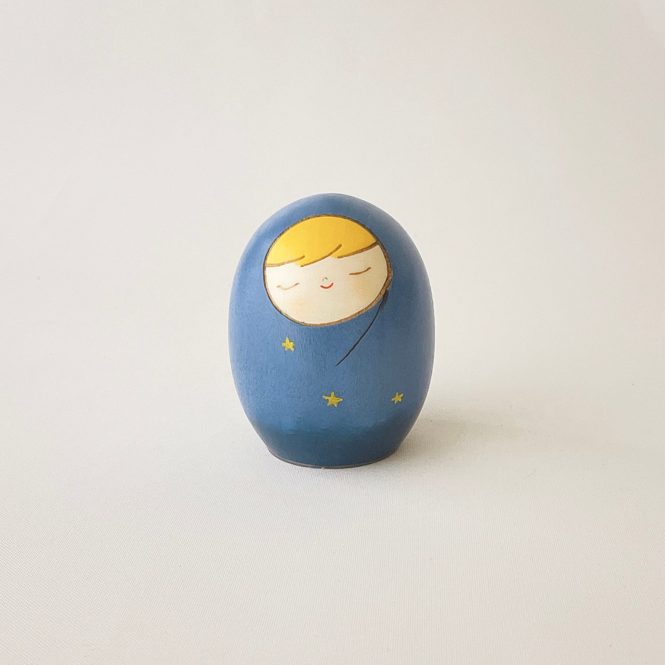 usaburo-kokeshi-yurakoro-heso-no-o-ire-blue-star-porte-cordon-ombilical-58x58x70 image 1